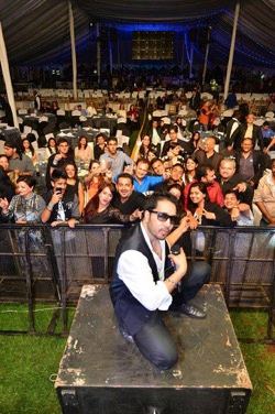 Mika Singh on stage in front of the crowd